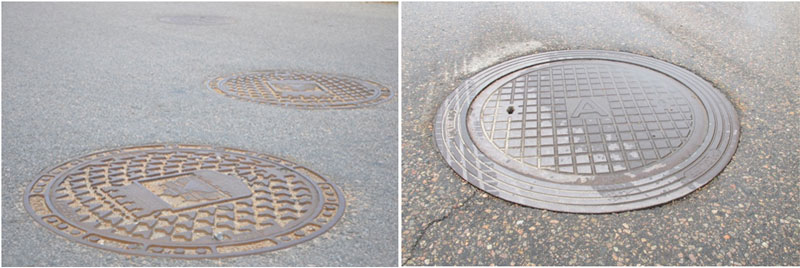 Brunnslock för nedstigningsbrunnar i gatan.
